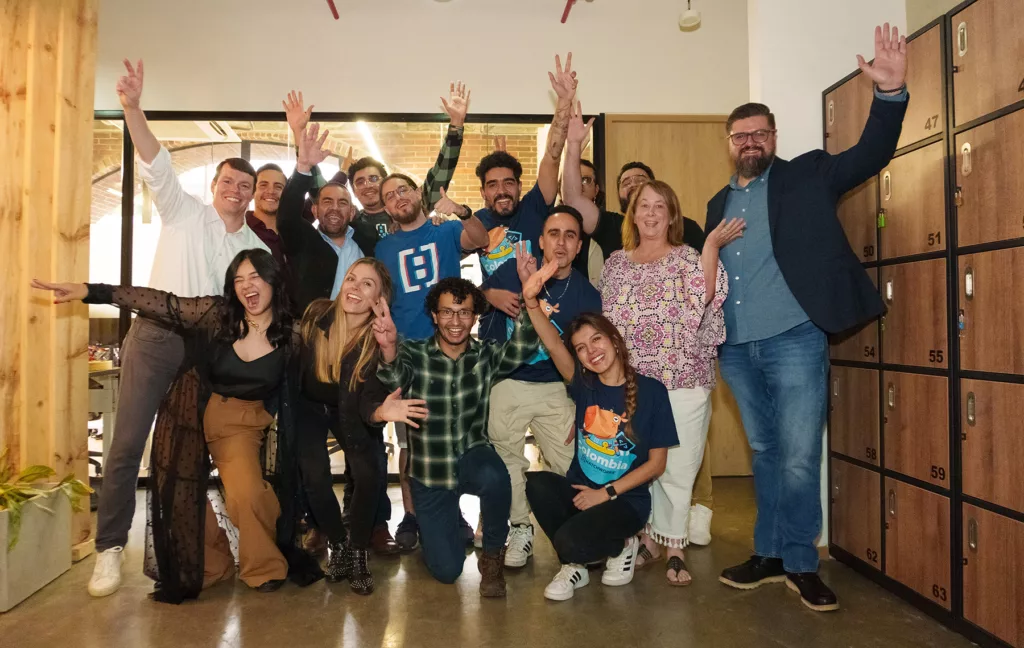 A group shot of Colombian Hatchers, gathered and smiling in their new HatchWorks office space.